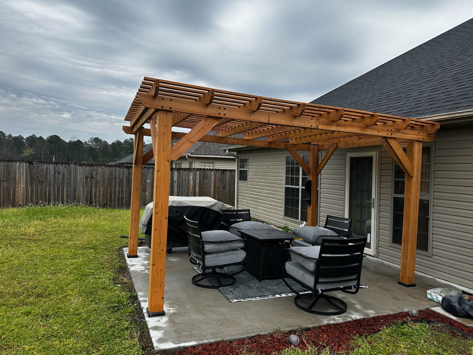 Finished cedar pergola patio cover built by PS Construction LLC in Little Rock, AR